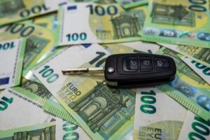 Car,Key,On,Euro,Bills,,Auto,Finance,And,Purchase,Concept