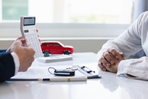 man working out how to save money on car key replacement